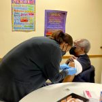 New Zion Pastor Dr SL Curry Gets Vaccinated